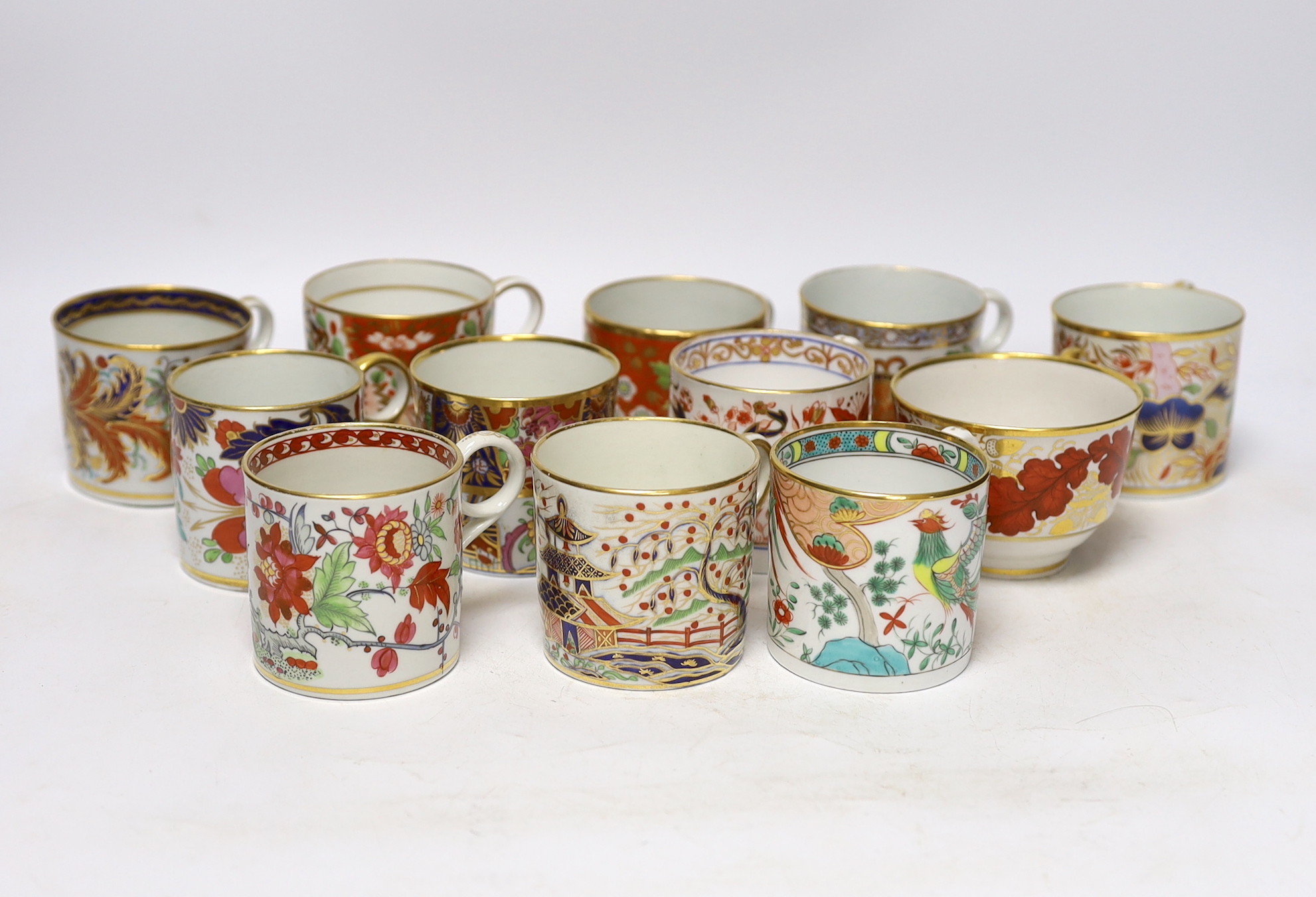 Twelve 1800-1820 English porcelain coffee cans and tea cups, including Imari pattern examples